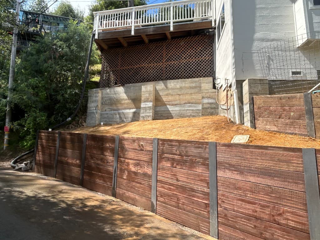 After retaining wall completion with stabilized grade and finished frontage